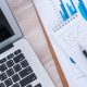 financial-charts-table-with-laptop-min